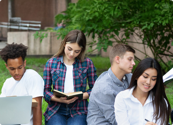 Young people reading in the yard